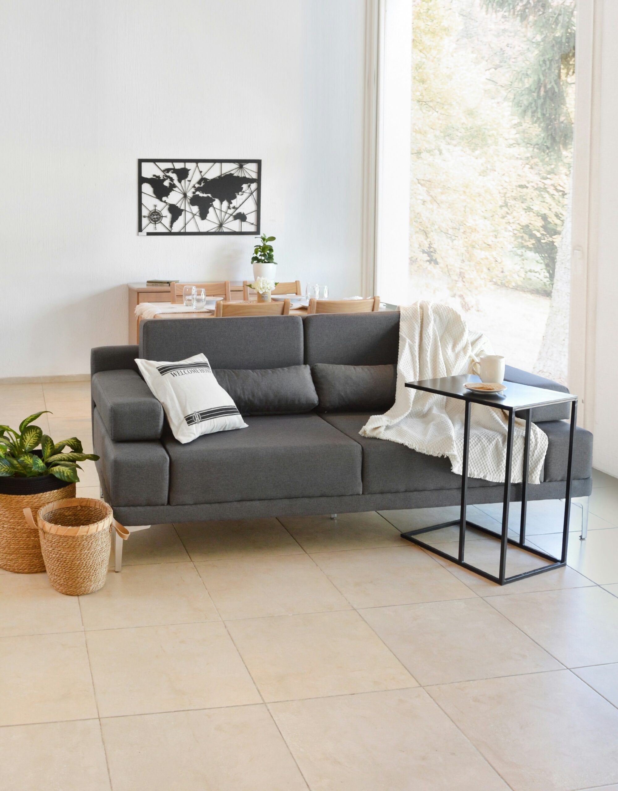modern living room with grey sofa, side table, and minimalist decor