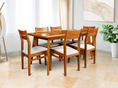 Wooden dining table and chairs set in bright modern dining room
