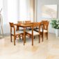 Wooden dining table and chairs set in bright modern dining room